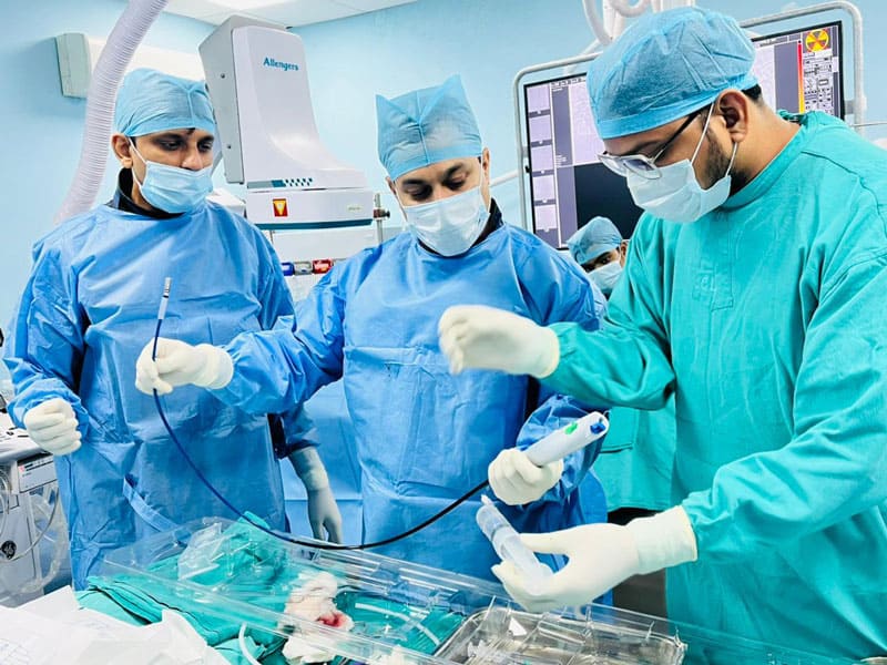 Medical team performing heart surgery in a hospital operating room.